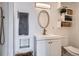 Bathroom featuring modern fixtures, storage, and sleek design at 7070 W 39Th Ave, Wheat Ridge, CO 80033