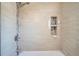 Nicely tiled bathroom with a shower-tub and decorative alcoves at 7070 W 39Th Ave, Wheat Ridge, CO 80033