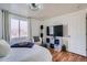 Bedroom featuring a TV, storage, and natural light from the window at 7070 W 39Th Ave, Wheat Ridge, CO 80033