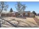 Inviting single-story brick home with a spacious driveway and well-maintained landscaping at 7070 W 39Th Ave, Wheat Ridge, CO 80033