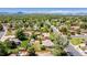 Aerial neighborhood shot featuring a single-story home with mountain views in the background at 8800 W Kentucky Ave, Lakewood, CO 80226