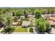 Scenic aerial view of a single-story home surrounded by lush trees at 8800 W Kentucky Ave, Lakewood, CO 80226