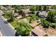 Aerial view of the backyard featuring a large, partially fenced yard with shed and nearby garage at 8800 W Kentucky Ave, Lakewood, CO 80226