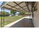 Large, shaded, backyard featuring a spacious patio with stamped concrete at 8800 W Kentucky Ave, Lakewood, CO 80226