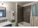 Bathroom with tiled shower-tub combo and a modern vanity at 8800 W Kentucky Ave, Lakewood, CO 80226