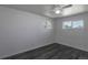 Bedroom features hardwood-style floors and large bright windows at 8800 W Kentucky Ave, Lakewood, CO 80226