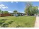 Charming single-story home with a well-maintained lawn and inviting curb appeal at 8800 W Kentucky Ave, Lakewood, CO 80226