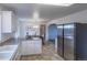 Open kitchen featuring stainless steel appliances, ample counter space, connecting dining area, perfect for modern living at 8800 W Kentucky Ave, Lakewood, CO 80226