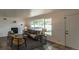 Inviting living room with a large window, cozy seating, and a fireplace, offering a relaxing space for Gathering and guests at 8800 W Kentucky Ave, Lakewood, CO 80226