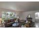Bright living room with modern decor, comfortable seating, and an open layout, great for entertaining or relaxing at 8800 W Kentucky Ave, Lakewood, CO 80226