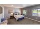 Spacious bedroom with large windows providing plenty of natural light at 8800 W Kentucky Ave, Lakewood, CO 80226