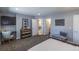 Open bedroom layout with neutral walls and modern furnishings at 8800 W Kentucky Ave, Lakewood, CO 80226
