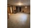 A finished basement boasts a fireplace and neutral carpeting at 14598 E Evans Ave, Aurora, CO 80014