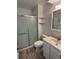 Bathroom with shower stall, toilet, and sink at 14598 E Evans Ave, Aurora, CO 80014