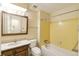 Full bathroom with bathtub, shower, and single sink vanity at 14598 E Evans Ave, Aurora, CO 80014