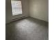 Bedroom with carpeting, a large window at 14598 E Evans Ave, Aurora, CO 80014