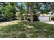 Traditional single-Gathering home featuring mature landscaping, a two-car garage, and a well-maintained lawn at 14598 E Evans Ave, Aurora, CO 80014