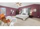 Bright and airy main bedroom with ceiling fan and sitting area at 7065 Campden Pl, Castle Pines, CO 80108