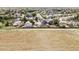An aerial view features a home nestled in a community with scenic surroundings at 3972 S Shawnee Way, Aurora, CO 80018