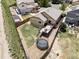 Aerial view of a backyard featuring a deck, trampoline, and well-maintained lawn at 3972 S Shawnee Way, Aurora, CO 80018