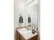 Bathroom featuring a stylish vanity, mirror, and a tastefully decorated countertop with modern fixtures at 3972 S Shawnee Way, Aurora, CO 80018