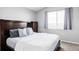 Cozy bedroom featuring a bed with decorative pillows and natural light from the window at 3972 S Shawnee Way, Aurora, CO 80018