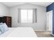 Bright bedroom boasts neutral paint, vaulted ceilings, and a large window for ample light at 3972 S Shawnee Way, Aurora, CO 80018