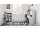 Bright bedroom features a built-in desk area and a large window offering natural light and a view at 3972 S Shawnee Way, Aurora, CO 80018