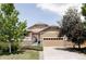 Charming single-Gathering home featuring manicured landscaping, stone accents, and an attached two-car garage at 3972 S Shawnee Way, Aurora, CO 80018