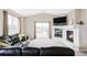 Spacious living room with a fireplace, offering a seamless transition to an outdoor deck for entertainment at 3972 S Shawnee Way, Aurora, CO 80018