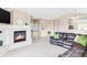Inviting living room with a cozy fireplace and neutral tones, offering a comfortable space for relaxation at 3972 S Shawnee Way, Aurora, CO 80018