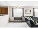 Open-concept living area showcasing natural light, a cozy dining nook, and a comfortable seating area at 3972 S Shawnee Way, Aurora, CO 80018