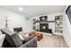 Finished basement featuring a fireplace, cozy seating area, and bright lighting at 1045 W 101St Ave, Northglenn, CO 80260