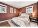 Cozy bedroom with a comfortable bed, two windows, and tastefully decorated walls at 1045 W 101St Ave, Northglenn, CO 80260