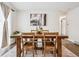 Elegant dining room featuring a wooden table, modern decor, and ample natural light at 1045 W 101St Ave, Northglenn, CO 80260