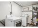 Convenient laundry area with washer, dryer, and a water heater at 1045 W 101St Ave, Northglenn, CO 80260