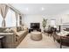 Bright living room featuring hardwood floors, stylish furniture, and an inviting atmosphere at 1045 W 101St Ave, Northglenn, CO 80260