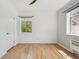 Bright bedroom with hardwood floors, large windows, and a closet at 1130 N Pennsylvania St # 208, Denver, CO 80203