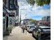 A bustling city street with shops and construction, illustrating urban development and commercial activity at 1130 N Pennsylvania St # 208, Denver, CO 80203