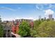 Rooftop view of buildings with a beautiful skyline and lush green trees at 1130 N Pennsylvania St # 208, Denver, CO 80203