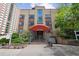 Charming brick apartment building with manicured landscaping, located at 1130 Penn at 1130 N Pennsylvania St # 208, Denver, CO 80203