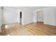 Spacious living room featuring hardwood floors, white walls, and natural light at 1130 N Pennsylvania St # 208, Denver, CO 80203