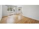 Spacious living room featuring gleaming hardwood floors, natural light, and an open layout at 1130 N Pennsylvania St # 208, Denver, CO 80203
