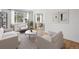 Bright living room with stylish furnishings, neutral tones, and views of outside greenery at 1130 N Pennsylvania St # 208, Denver, CO 80203