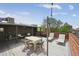 Inviting rooftop deck with lounge chairs, dining table and relaxing outdoor space at 1130 N Pennsylvania St # 208, Denver, CO 80203