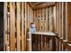 Storage space with rustic wooden shelving, paint cans, and boxes at 1130 N Pennsylvania St # 208, Denver, CO 80203