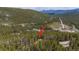 Remote mountain homesite with easy access to the main road and winding roads among the trees at 542 Harris Dr, Idaho Springs, CO 80452