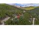 Mountain community homesite surrounded by pine trees with views of mountains in the background at 542 Harris Dr, Idaho Springs, CO 80452
