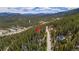 Wooded mountain homesite with dirt road access and easy access to nearby home with solar at 542 Harris Dr, Idaho Springs, CO 80452