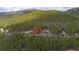 Mountain community homesite nestled in the trees with easy access to nearby homes at 542 Harris Dr, Idaho Springs, CO 80452
